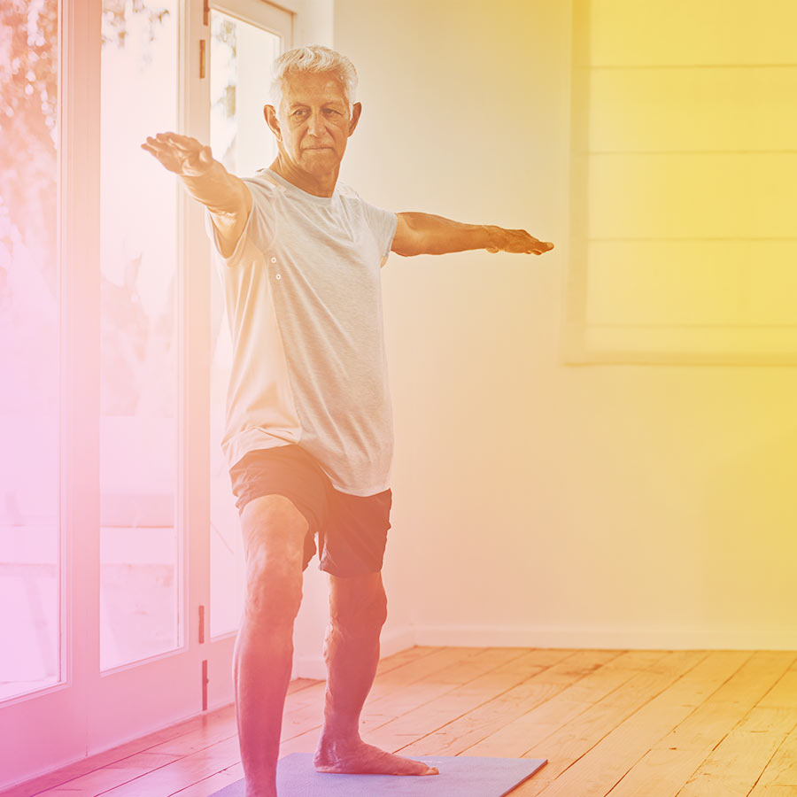 older male doing yoga